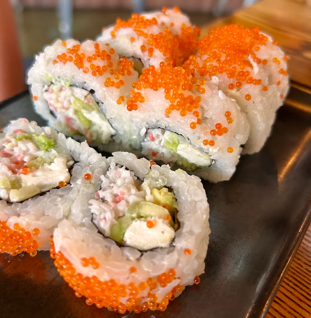Sushi roll topped with tobiko
